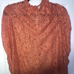 This item was purchased from a Boutique. This sheer blouse is gorgeous